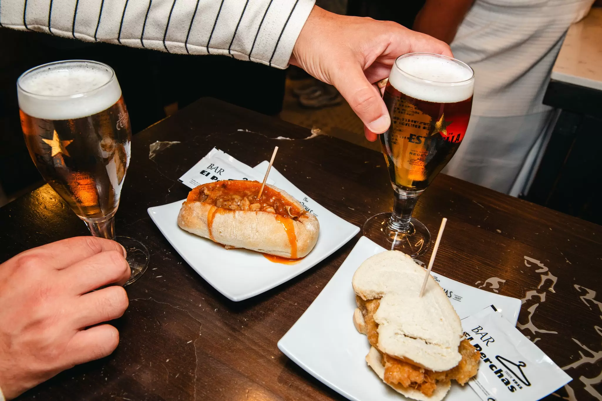 Calle Laurel, Logroño
The picante and fried pig ear pintxos with two beers at El Perchas. Pig ear is served two ways, both on bread. "Spicy" with sauce or fried. Friday, Aug. 28, 2026, Logroño, La Rioja, Spain (Andrea Arevalo for Lonely Planet)
TURESPAÑA
