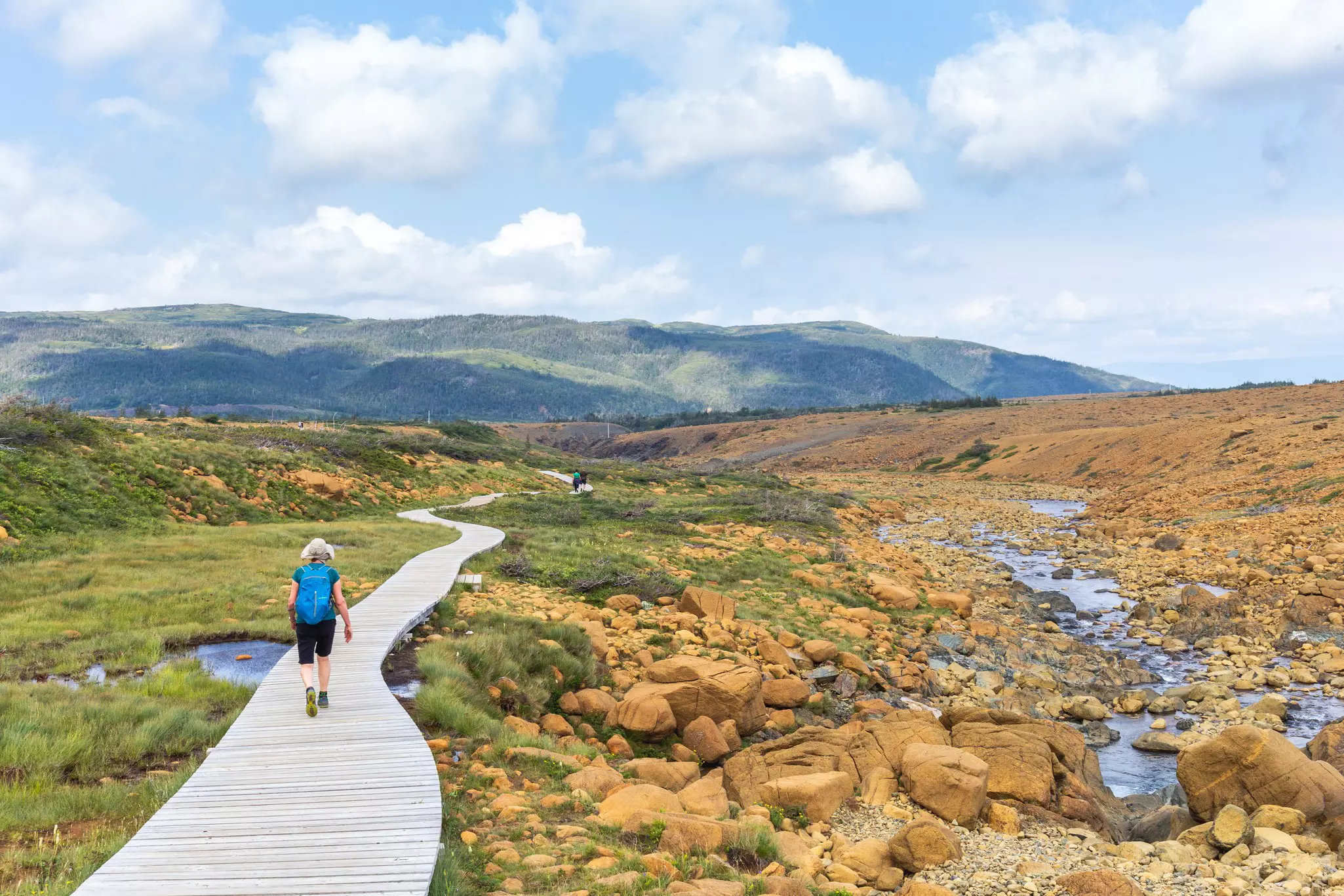 Hikers in the Tablelands, Gros Morne National Park, near Woody Point, Newfoundland, Canada