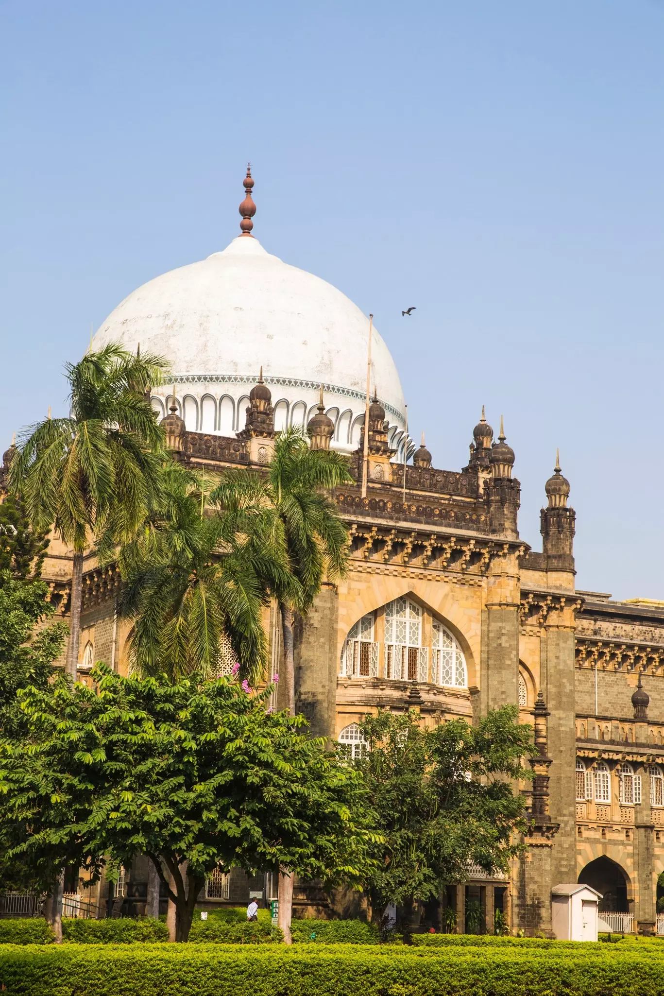 A vast domed building with intricate details around its archways and windows.