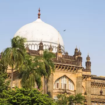 A vast domed building with intricate details around its archways and windows.
