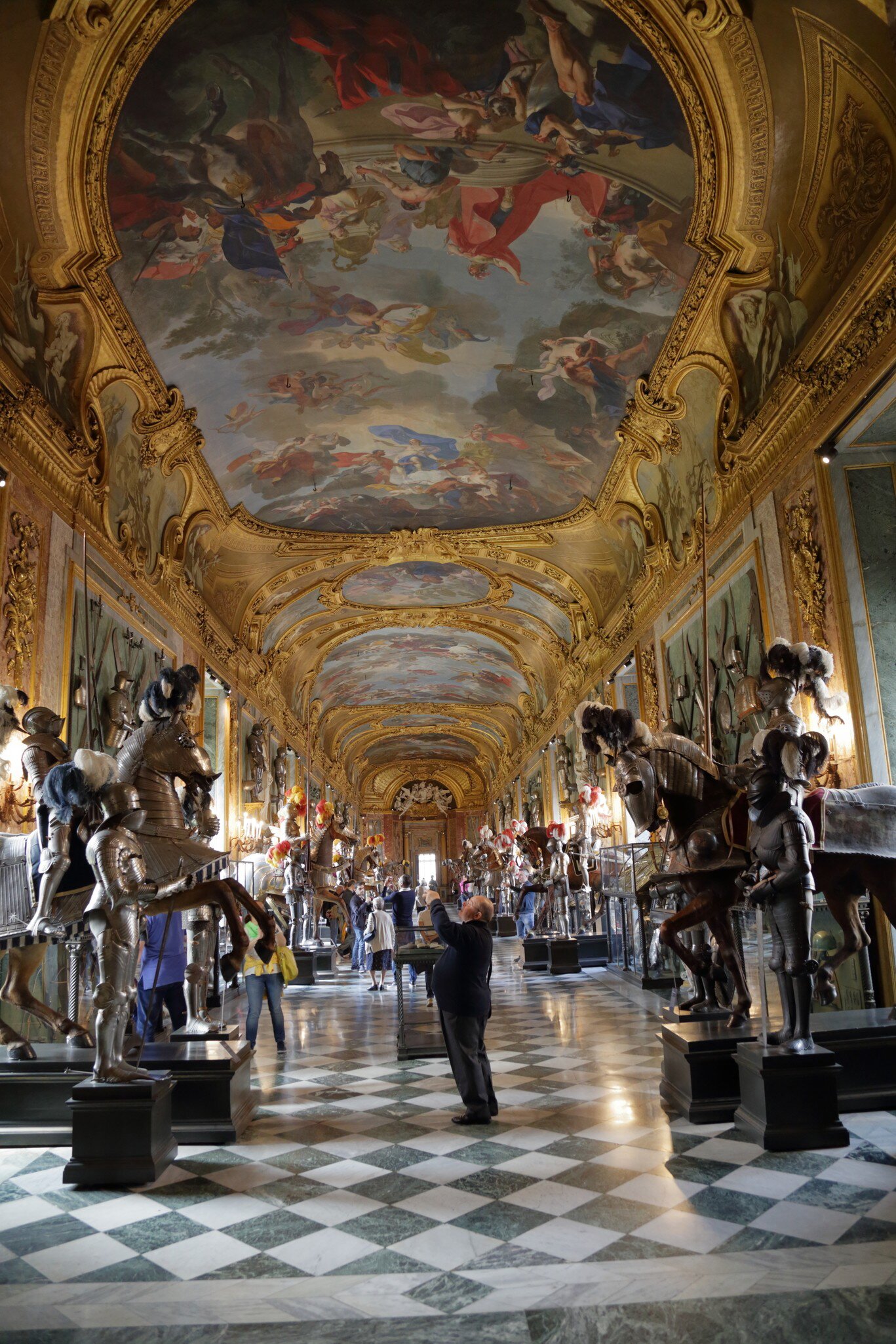 Tourists take photos of the interior of the magnificent Royal Palace.