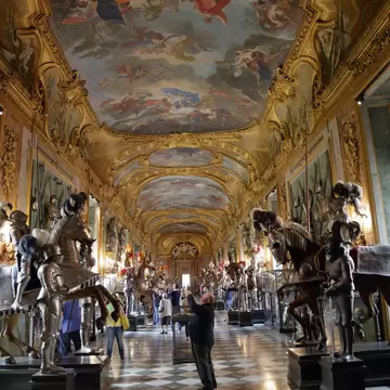 Tourists take photos of the interior of the magnificent Royal Palace.
