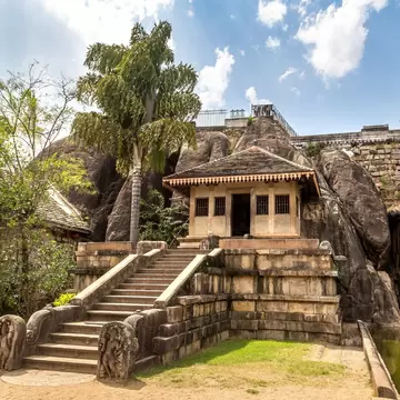 Exterior of Isurumuniya Viharaya on a summer day in Anuradhapura, Sri Lanka.