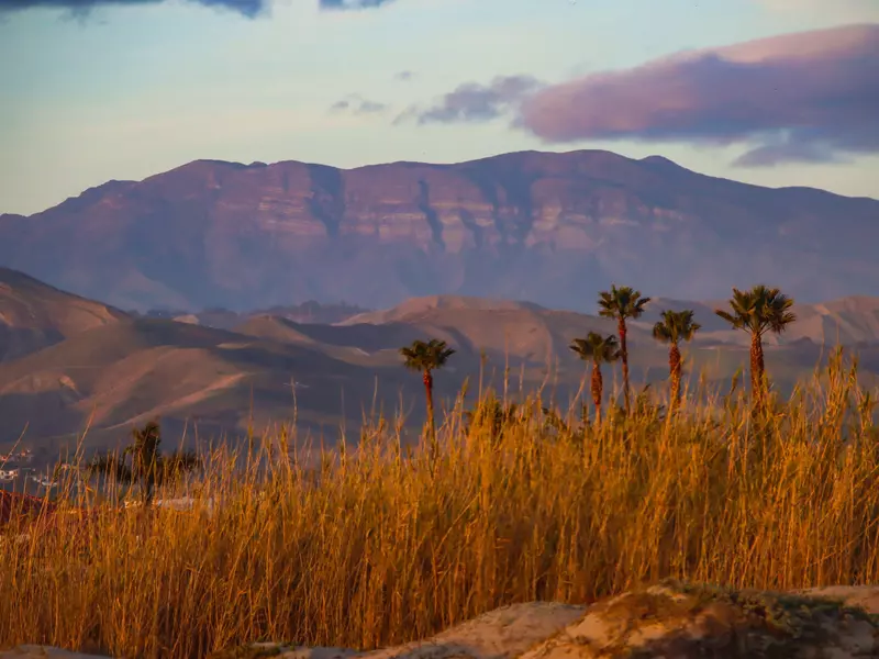 A view at twilight of the Topatopa Mountains in Ojai as seen from Surferâ€™s Knoll Beach in Ventura, 23 miles away.
