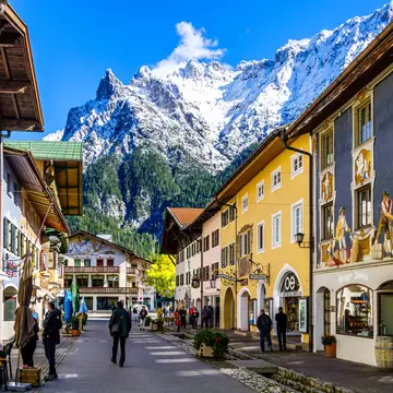 Mittenwald, Germany - September 27: historic buildings and tourists at the famous old town of Mittenwald on September 27, 2020