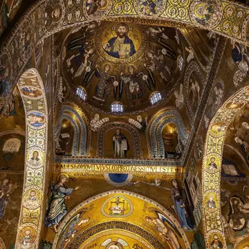 Gilded Byzantine mosaics of Christ, angels and saints cover the dome, arches and apse of Palermo's Cappella Palatina