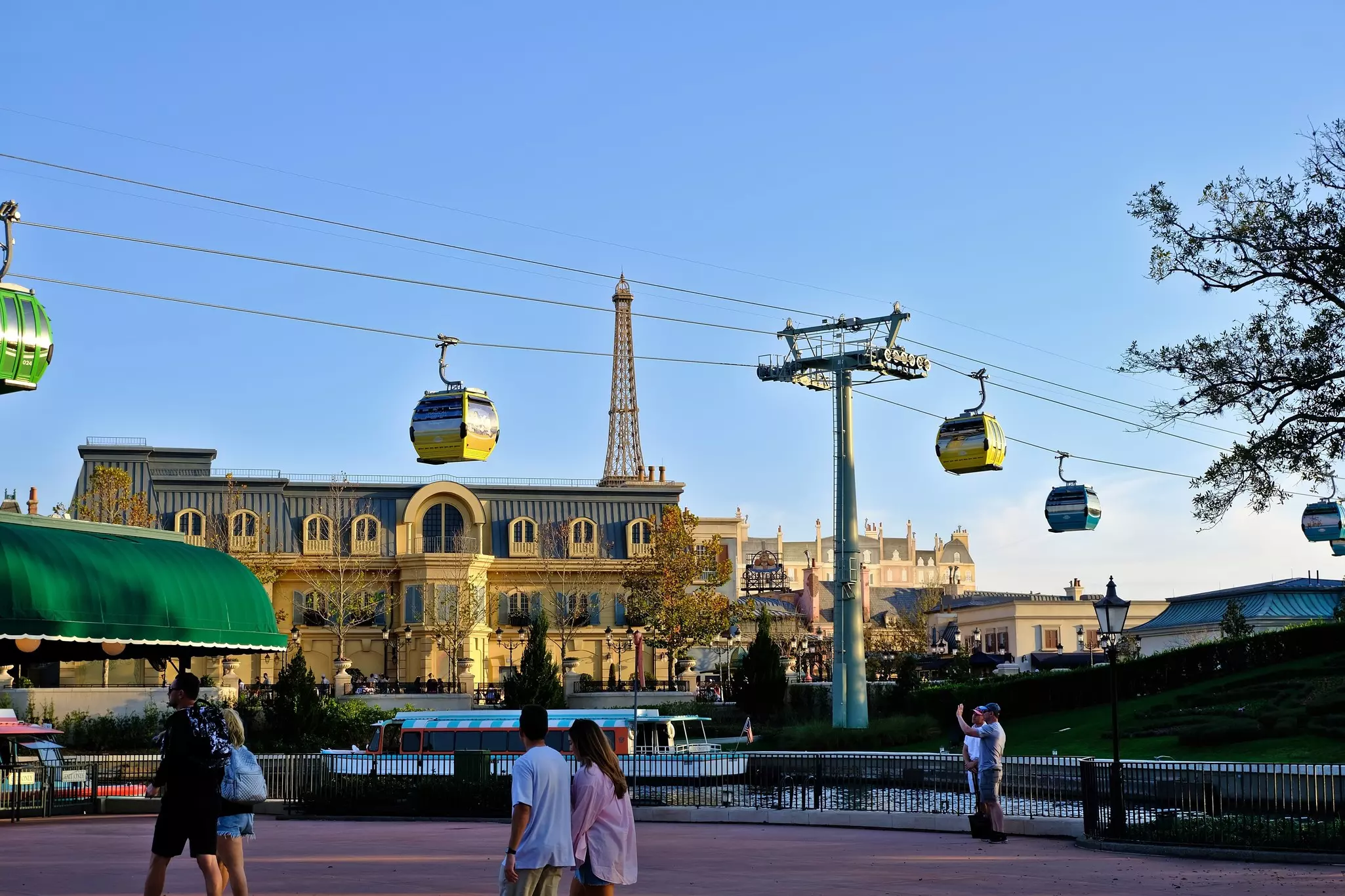 The skyliner at Disney World sails over Epcot's Paris