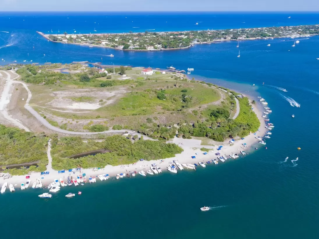 Aerial view of Peanut Island in Riviera Beach, Florida on memorial day weekend. Clear skies and blue water with plenty of boaters