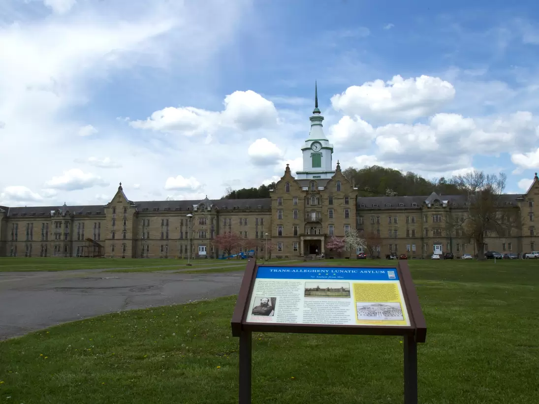 Weston, WV, USA - May 3, 2015 :  Sign in front of Trans-Allegheny Lunatic Asylum building and grounds.