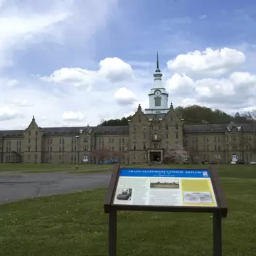 Weston, WV, USA - May 3, 2015 :  Sign in front of Trans-Allegheny Lunatic Asylum building and grounds.