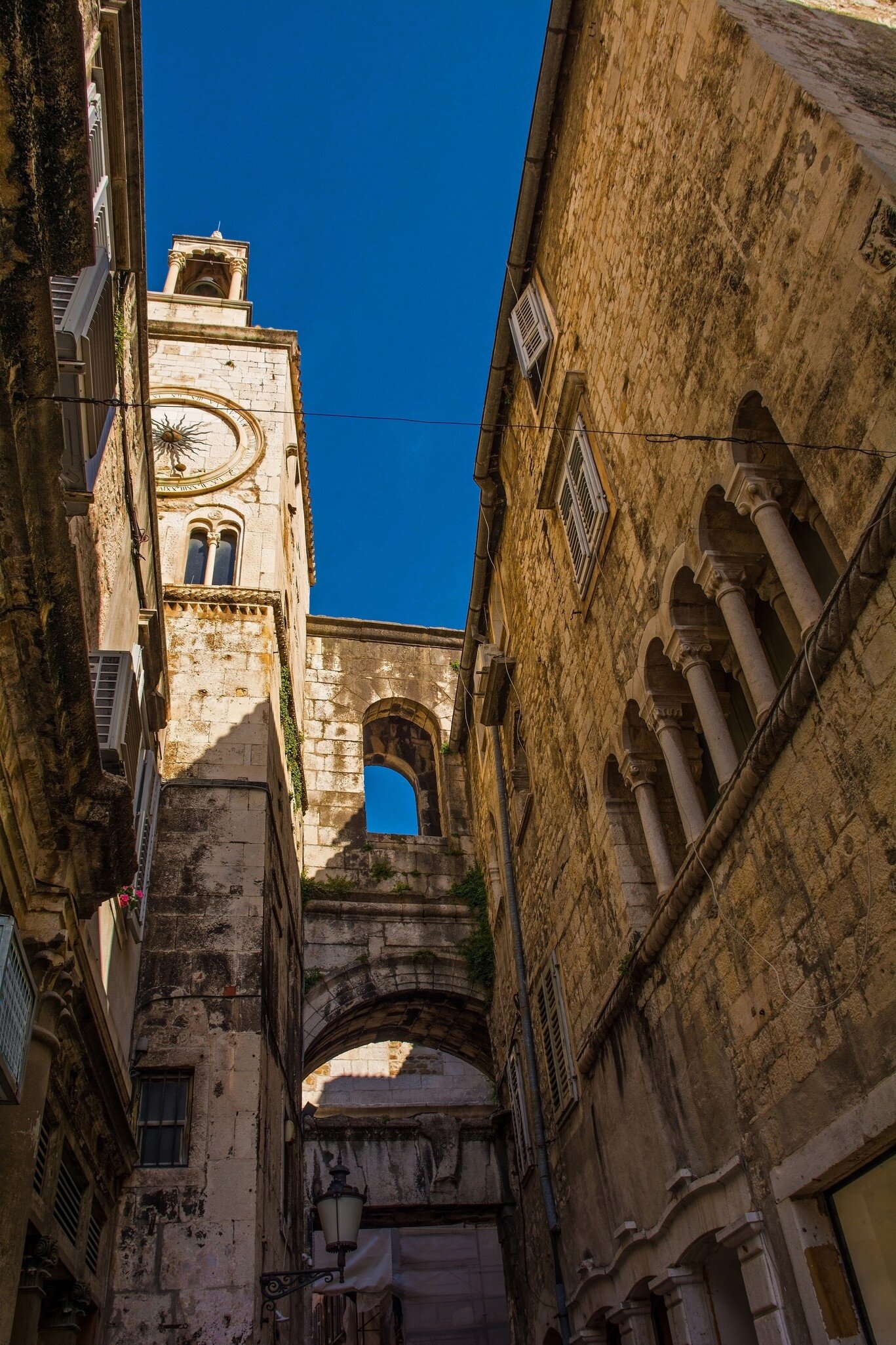 Pjaca Clock Tower and Zeljezna Vrata or Iron Gate seen from the historic Narodni Trg - People’s Square - in the centre of Split, Croatia. Cyprian's Palace on the right, License Type: media, Download Time: 2026-02-11T20:01:25.000Z, User: LP_YKhanna, Editorial: false, purchase_order: 65050 - Digital Destinations and Articles, job: LP, client: App Content, other: Yuvraj Khanna