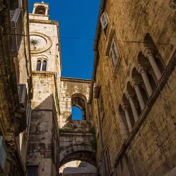 Pjaca Clock Tower and Zeljezna Vrata or Iron Gate seen from the historic Narodni Trg - People’s Square - in the centre of Split, Croatia. Cyprian's Palace on the right, License Type: media, Download Time: 2026-02-11T20:01:25.000Z, User: LP_YKhanna, Editorial: false, purchase_order: 65050 - Digital Destinations and Articles, job: LP, client: App Content, other: Yuvraj Khanna