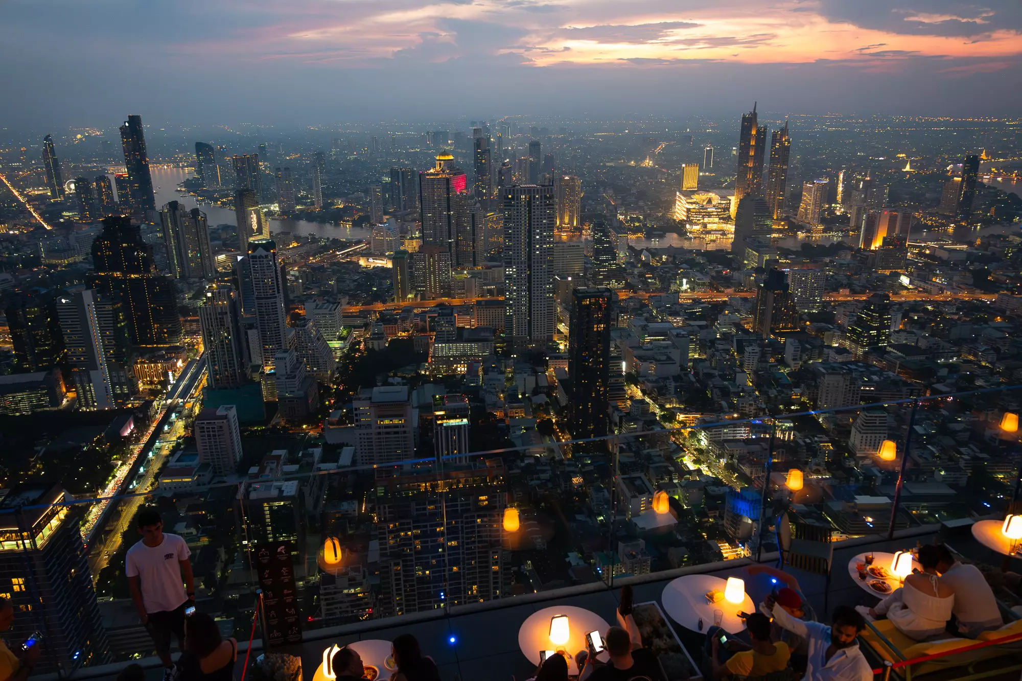 The city lights at night from the rooftop at Skywalk Mahanakhon in Bangkok, Thailand