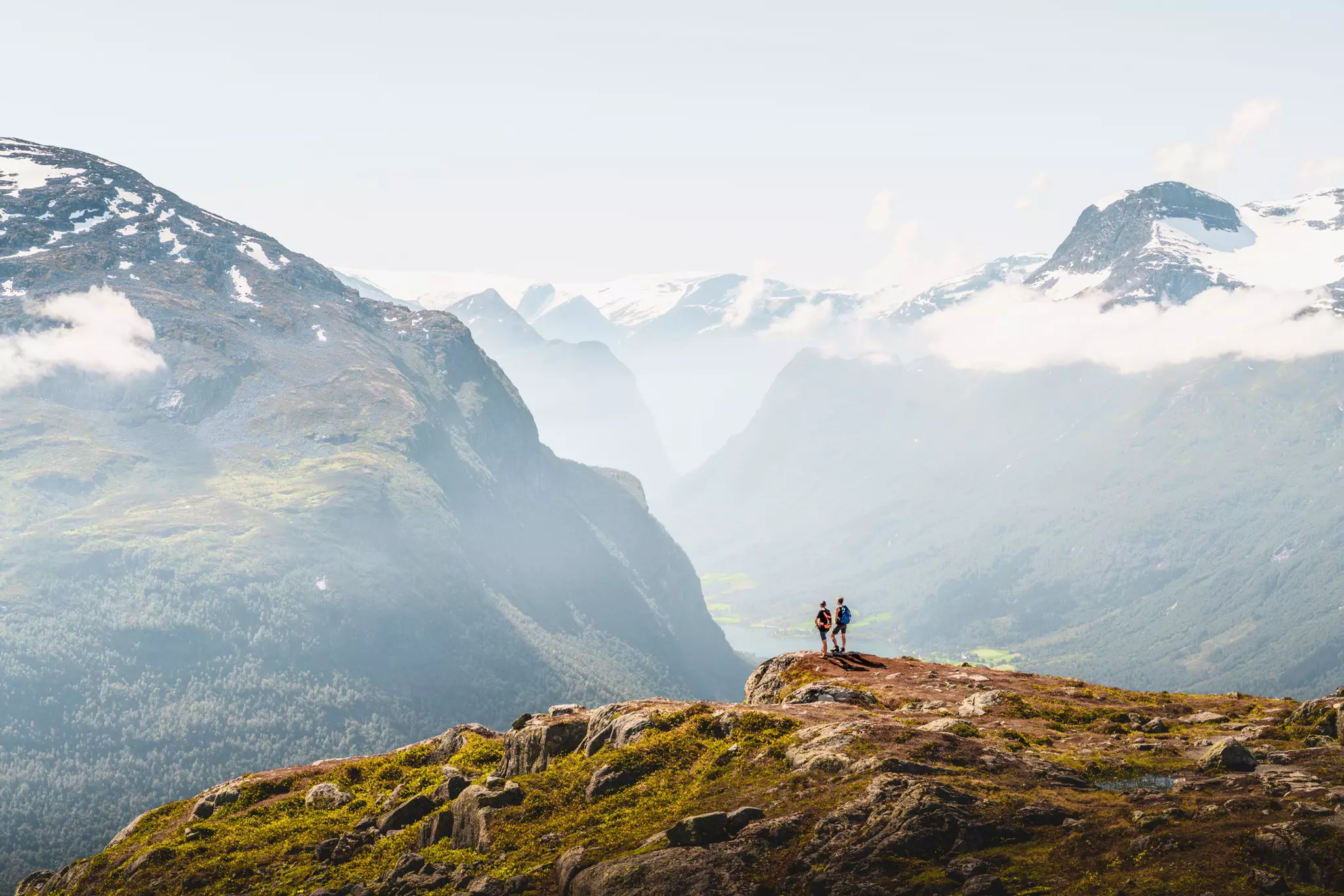 Visitors admire the view from a mountaintop near the village of Leon, Norway © Marco Bottigelli / Getty Images