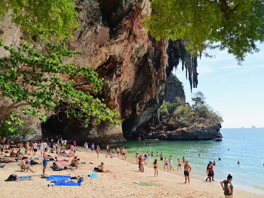 Tourists relaxing at Phra Nang Beach Near Railay Beach in Krabi, Thailand. 