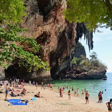 Tourists relaxing at Phra Nang Beach Near Railay Beach in Krabi, Thailand. 