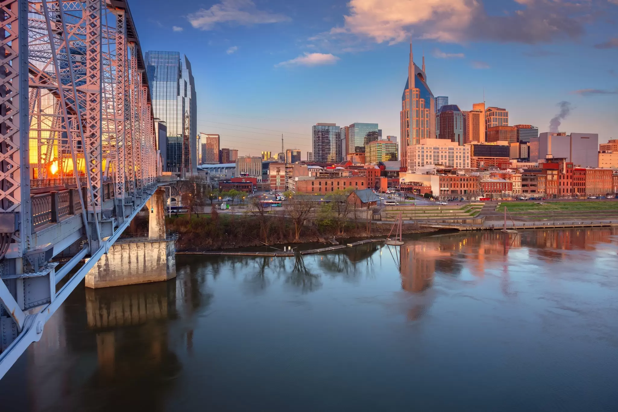 Nashville’s skyline next to the Cumberland River at sunrise. Rudy Balasko/Shutterstock