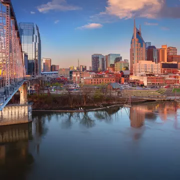 Nashville’s skyline next to the Cumberland River at sunrise. Rudy Balasko/Shutterstock