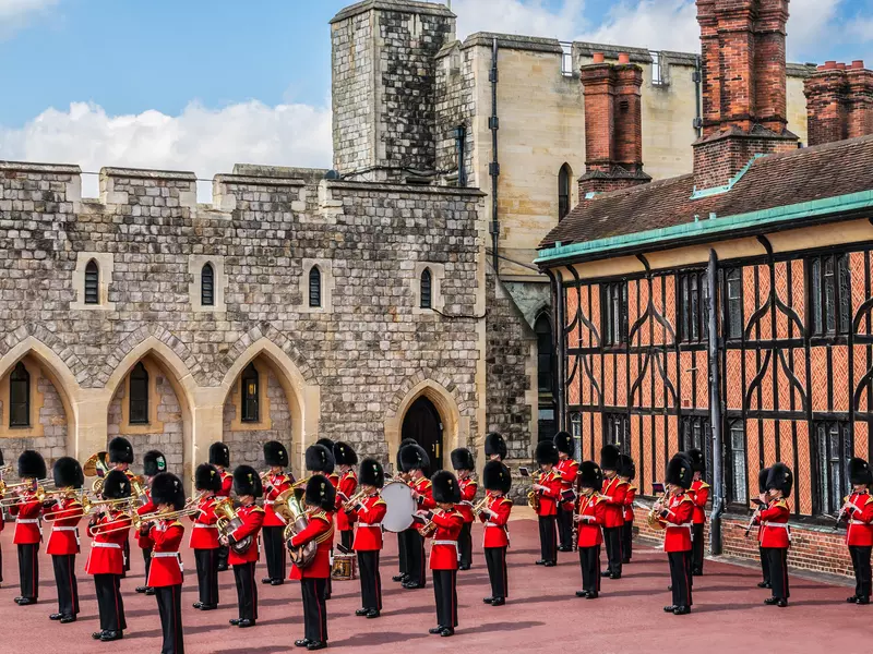 Changing Guard Ceremony takes place in Windsor Castle. British Guards in red uniforms are among the most famous in the world.  