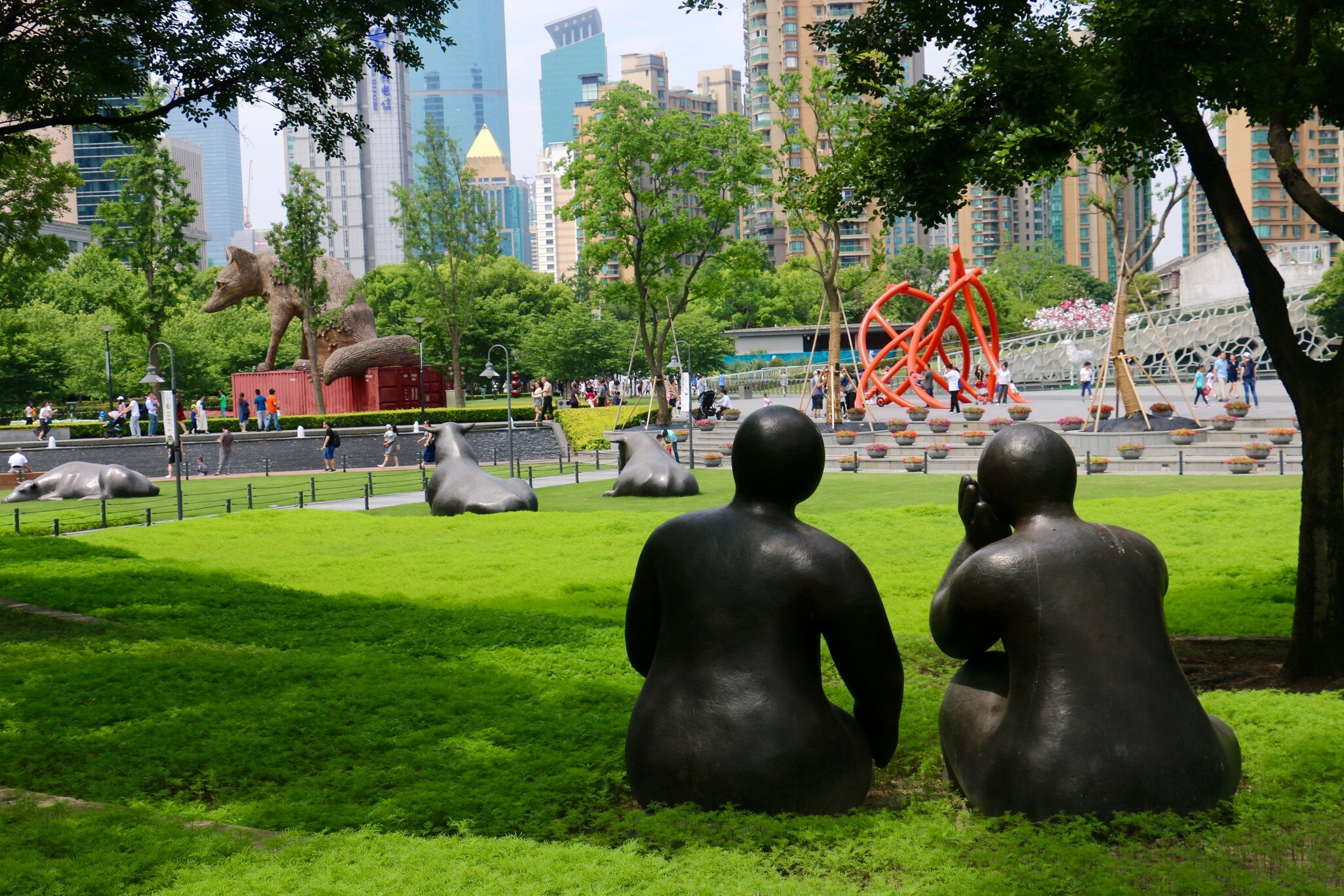 Shanghai, China - May 31 2017: Steel sculpture of two seated people at Jing'an Sculpture Park, License Type: media, Download Time: 2026-08-25T19:16:14.000Z, User: LP_NZhan, Editorial: true, purchase_order: 65050 - Digital Destinations and Articles, job: App Content, client: Lonely Planet  App, other: Nadine Zhan
