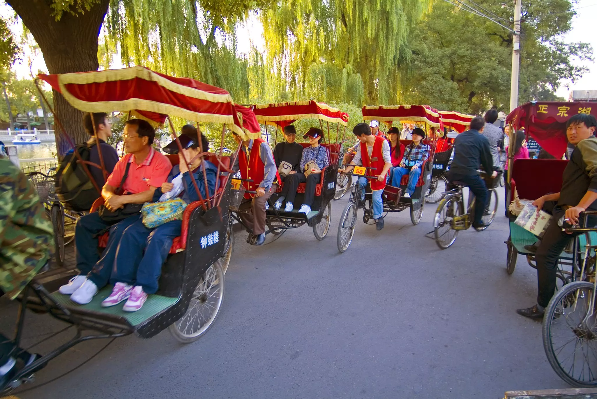 People riding rickshaws in Beijing.