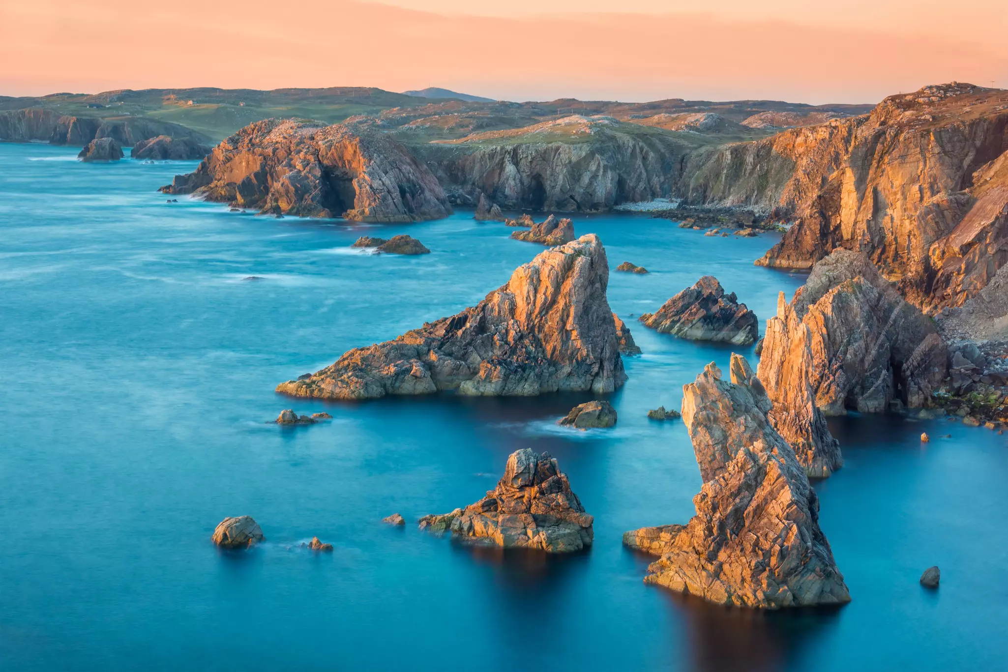 Long exposure golden hour sunset over Mangersta sea stacks on the Isle of Lewis