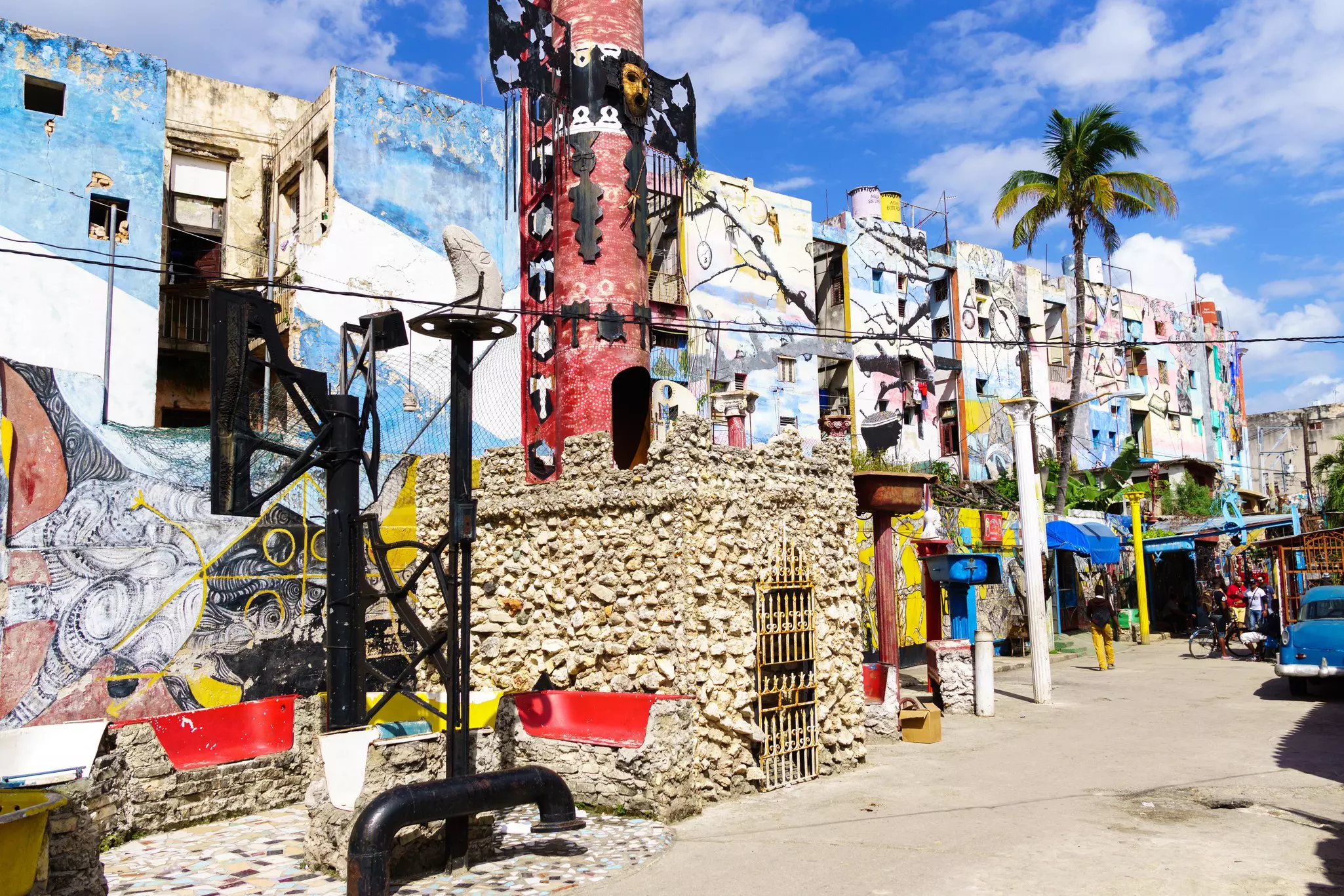 Vibrant street art in blues, reds and yellows, covers the walls of buildings