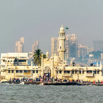 View of the Haji Ali Dargah, a famous tomb and mosque, on an island out at sea in Mumbai, India.