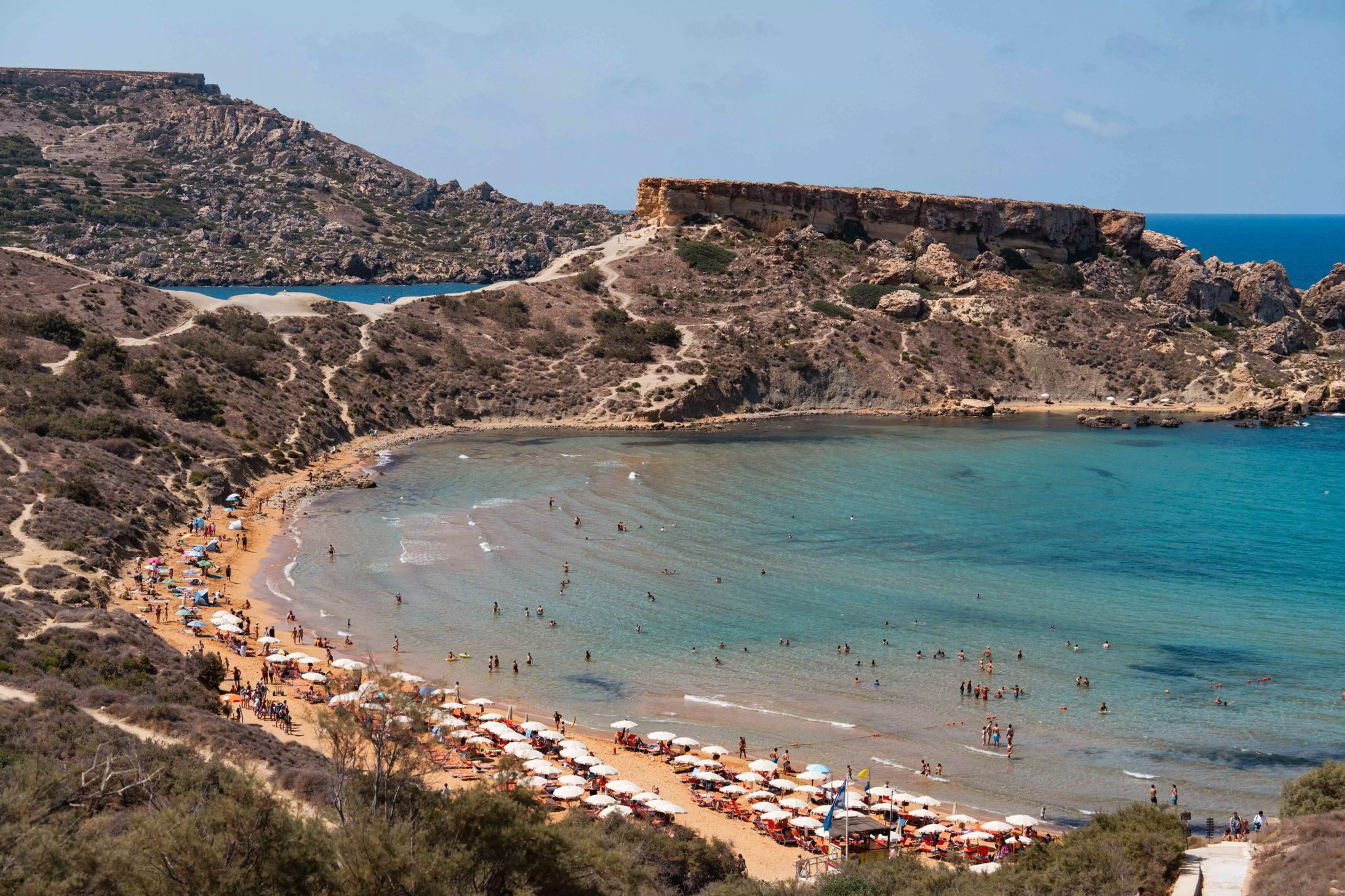 Beachgoers in Għajn Tuffieħa Bay.
