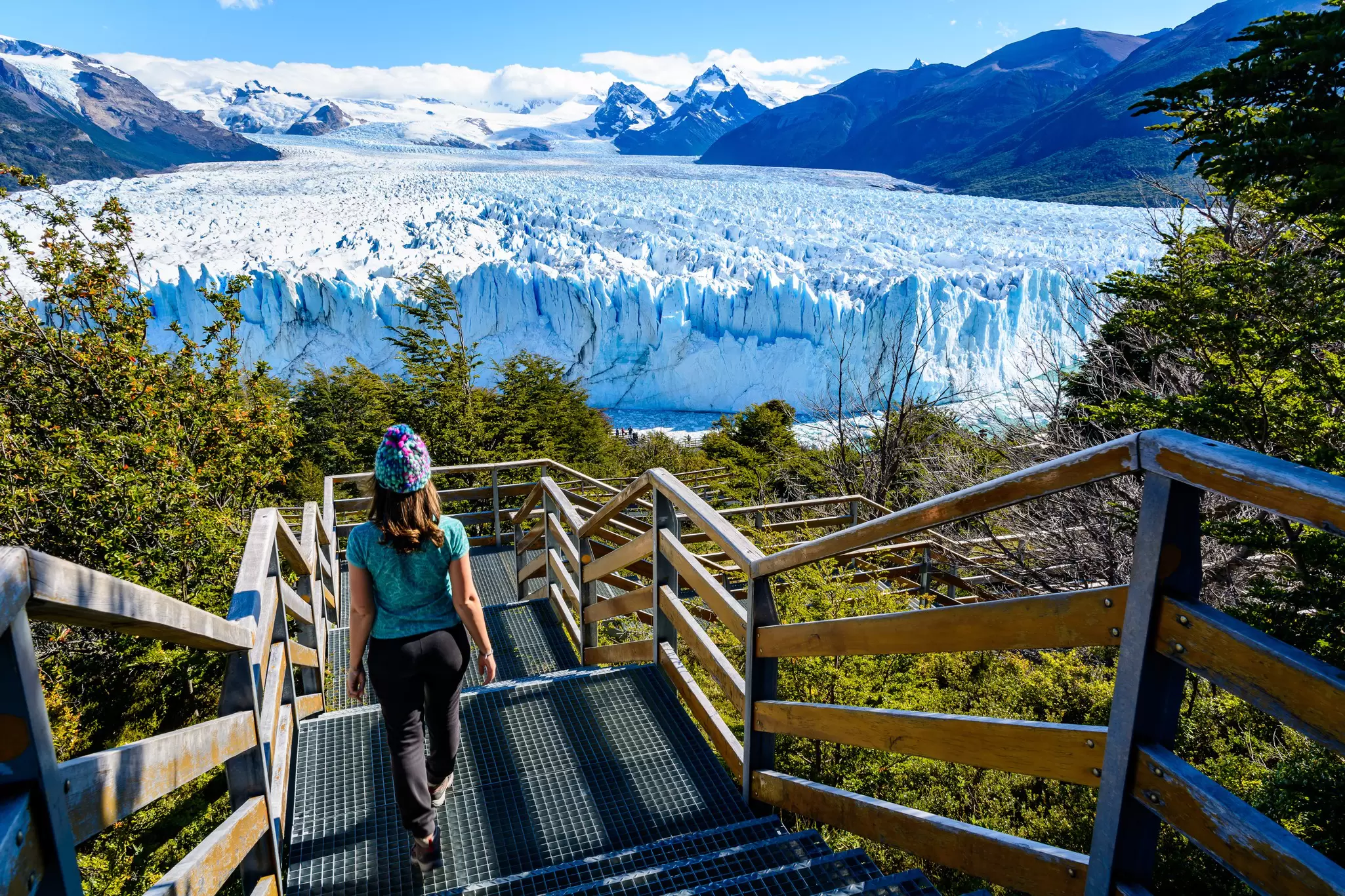 A female tourist going down a ramp to the Perito Moreno Glacier in Argentina.