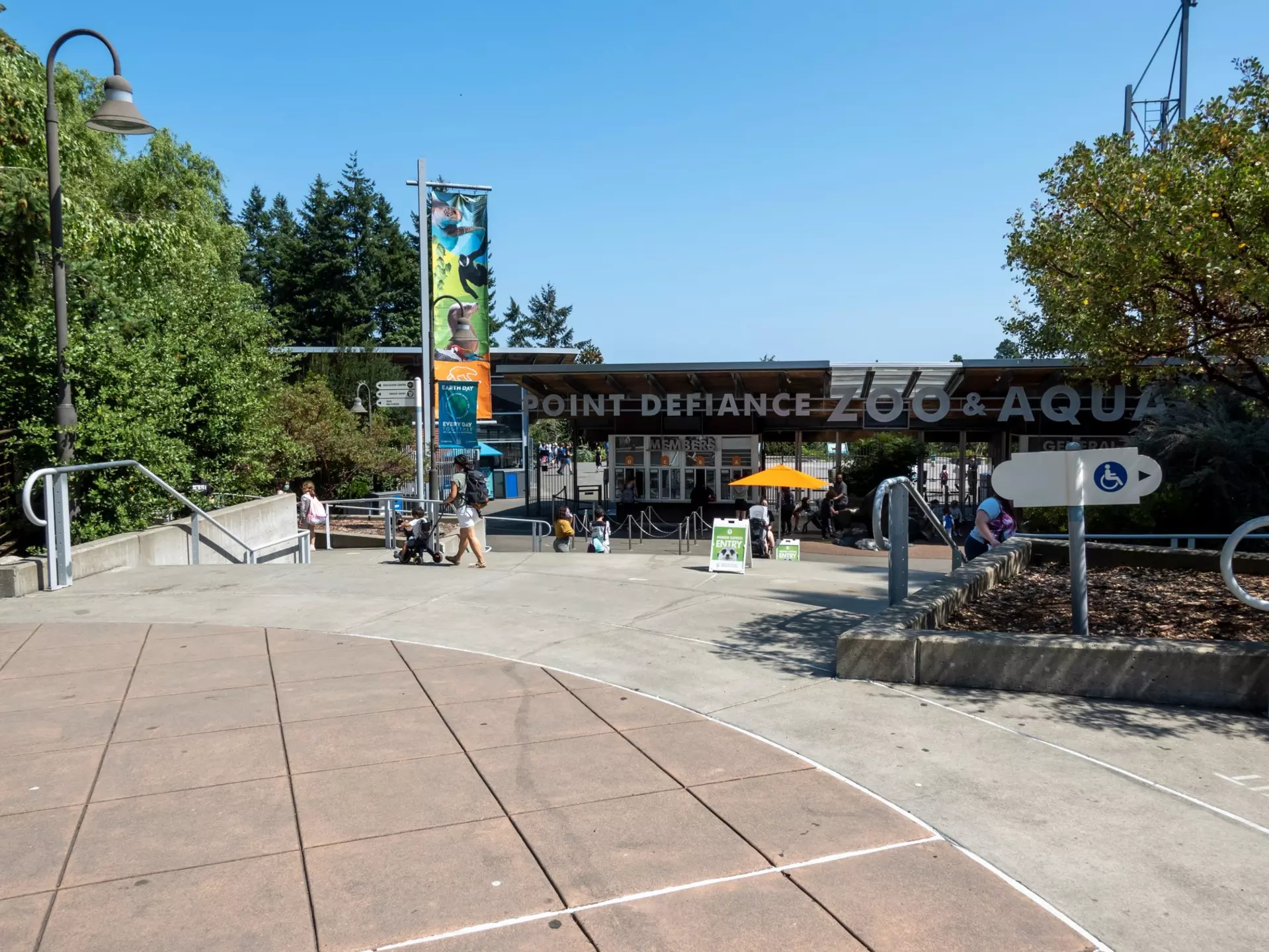 Tacoma, WA USA - circa August 2021: View of the entrance to Point Defiance Zoo and Aquarium on a sunny day during covid 19., License Type: media, Download Time: 2025-08-14T03:02:20.000Z, User: claramonitto, Editorial: true, purchase_order: 56530 - Guidebooks, job: Global Publishing-WIP, client: Washington, Oregon & Pacific Northwest 10, other: Clara Monitto