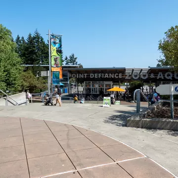 Tacoma, WA USA - circa August 2021: View of the entrance to Point Defiance Zoo and Aquarium on a sunny day during covid 19., License Type: media, Download Time: 2025-08-14T03:02:20.000Z, User: claramonitto, Editorial: true, purchase_order: 56530 - Guidebooks, job: Global Publishing-WIP, client: Washington, Oregon & Pacific Northwest 10, other: Clara Monitto