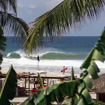 Surfer looking the wave breaking at Zicatela beach, Mexico; Shutterstock ID 749690260; your: Sloane Tucker; gl: 65050; netsuite: Online Editorial; full: POI