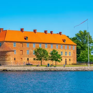 Facade of Sønderborg Slot in Denmark during a sunny day.