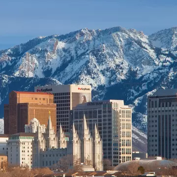 Mormon Tabernacle and buildings of Salt Lake City with the Wasatch Mountains beyond, Utah USA. Image shot 2012. Exact date unknown.