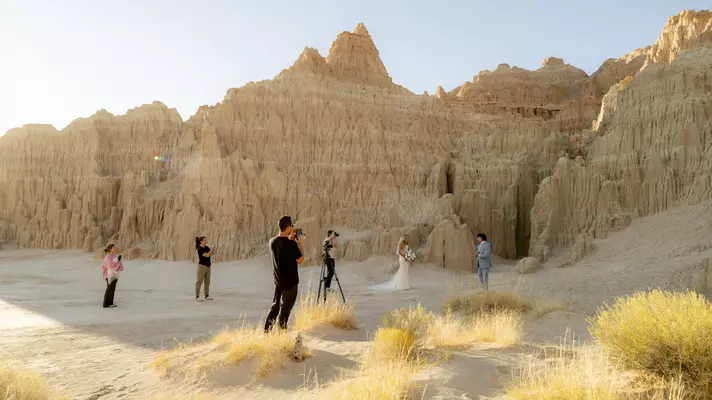 A couple has a wedding photo shoot at Cathedral Gorge State Park