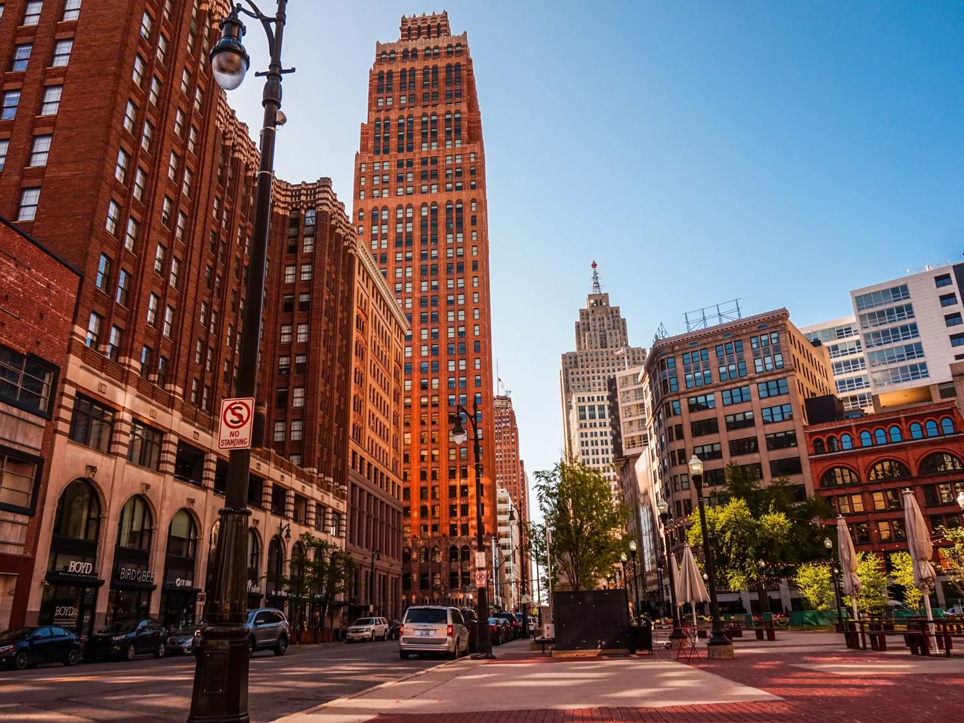 Tall buildings lining a street in downtown Detroit. nvphoto/Getty Images