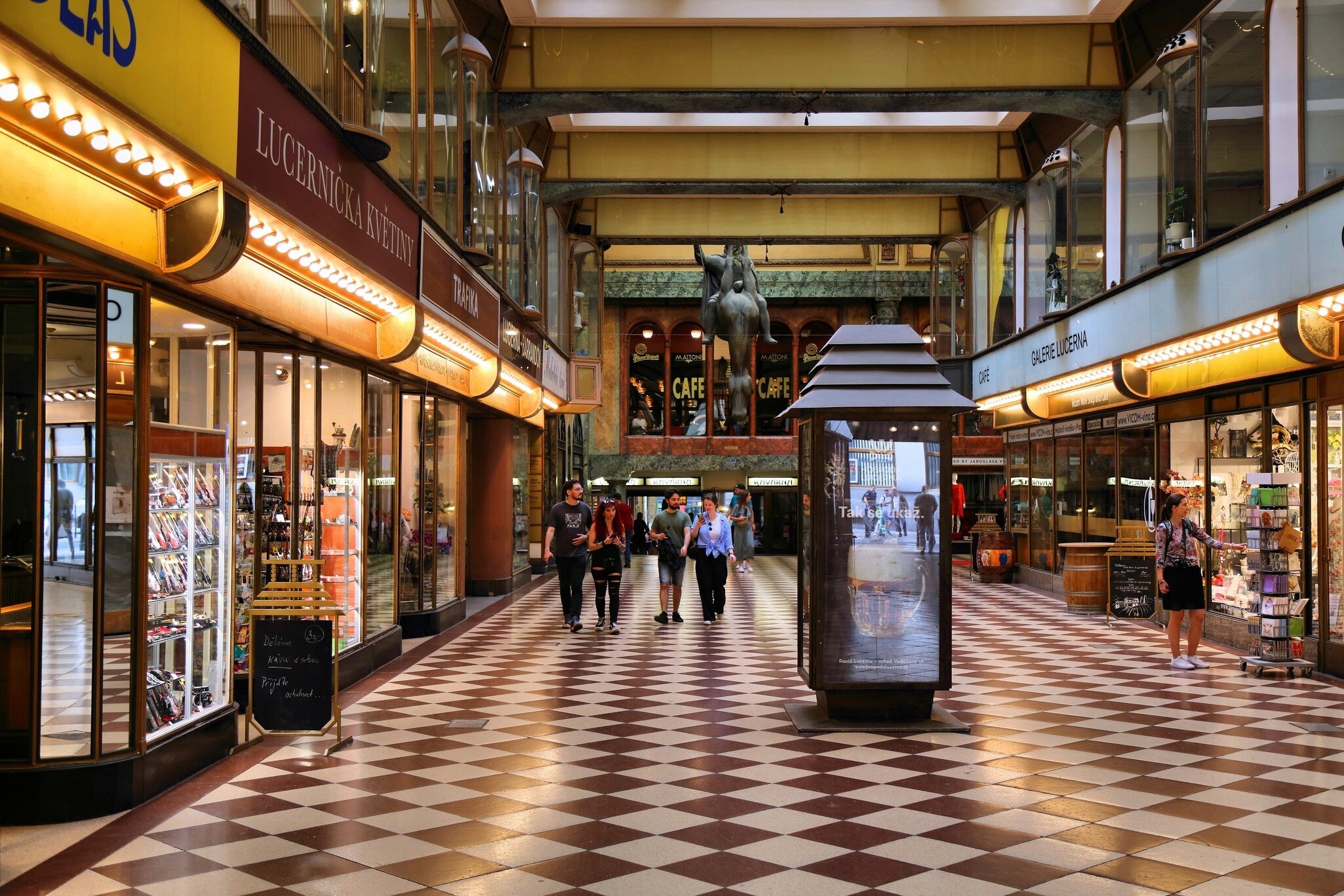 People visit Lucerna Palace entertainment complex, national cultural monument in New Town (Nove Mesto) district of Prague, Czech Republic.