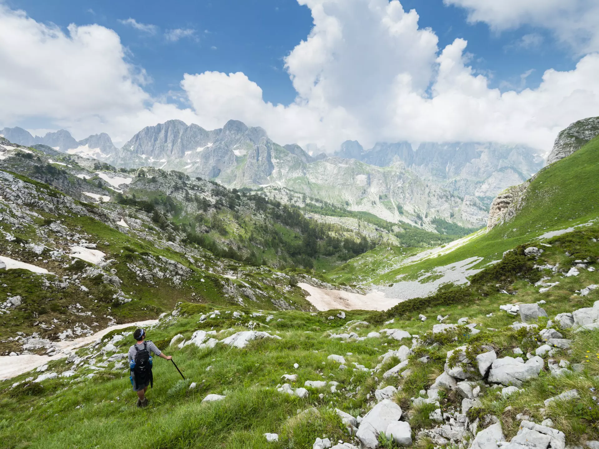 Walker descending Maja e Rosit peak.
