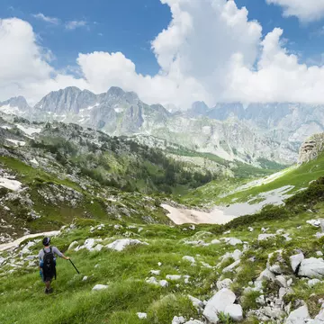 Walker descending Maja e Rosit peak.