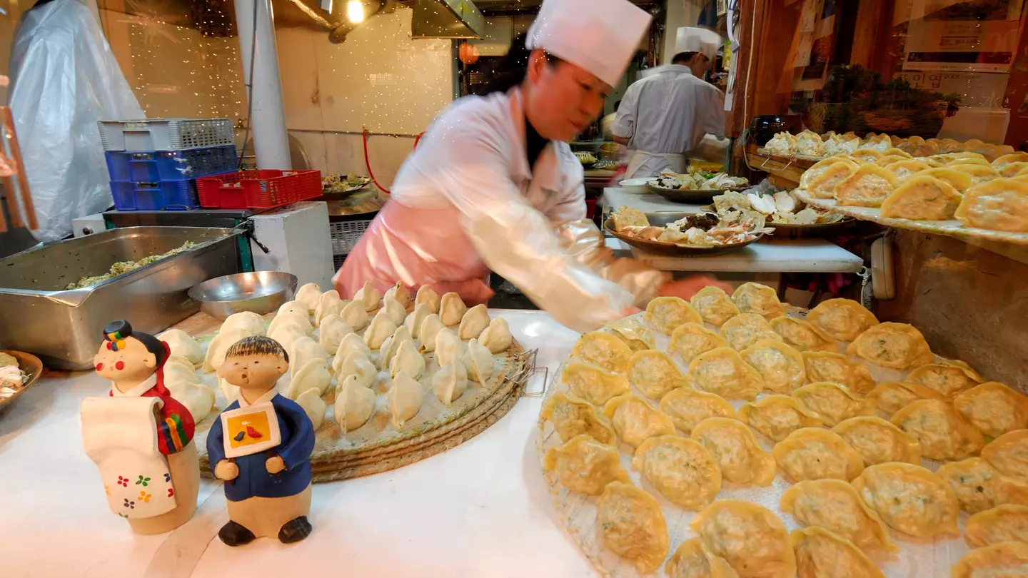 Woman making mandu (dumplings) in Seoul, South Korea