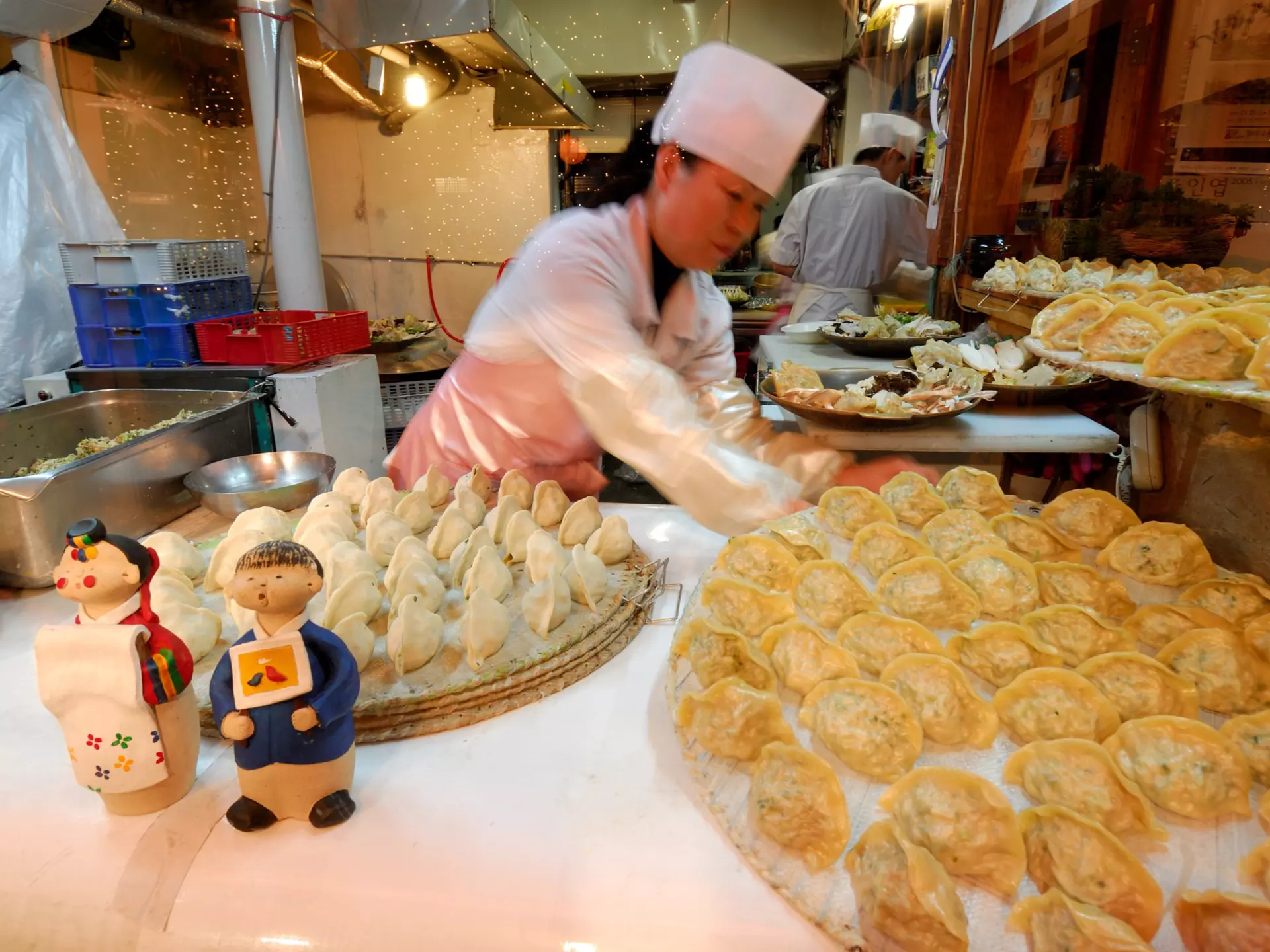 Woman making mandu (dumplings) in Seoul, South Korea