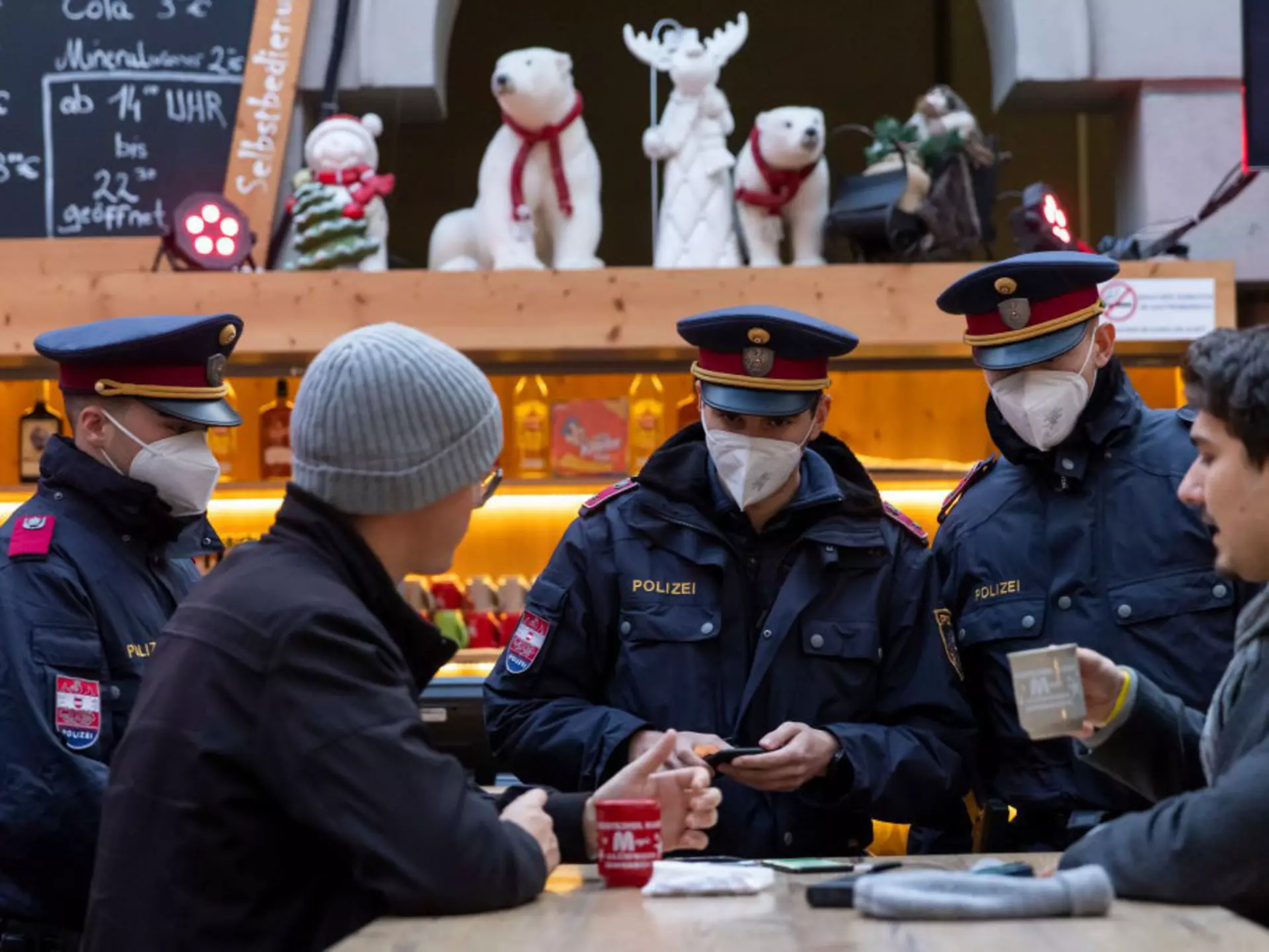 INNSBRUCK, AUSTRIA - NOVEMBER 15: Police officers monitor compliance with the lockdown in Innsbruck's old town during the first day of a nationwide lockdown for people not yet vaccinated against the novel coronavirus on November 15, 2021 in Innsbruck, Austria. Starting today unvaccinated people may only leave their homes for a worthy reason, including going to work, buying groceries, going to the doctor or getting a vaccine shot. Austria is struggling to bring down a Covid infection rate that has reached over 770 infections per 100,000 people over a seven-day period. (Photo by Jan Hetfleisch/Getty Images)
1353452223