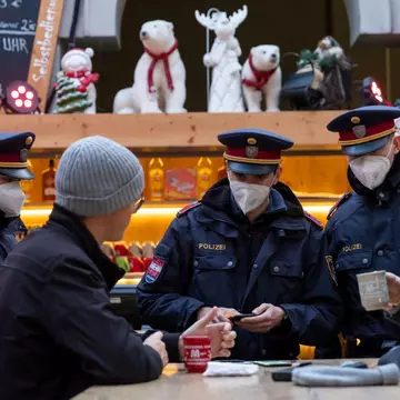 INNSBRUCK, AUSTRIA - NOVEMBER 15: Police officers monitor compliance with the lockdown in Innsbruck's old town during the first day of a nationwide lockdown for people not yet vaccinated against the novel coronavirus on November 15, 2021 in Innsbruck, Austria. Starting today unvaccinated people may only leave their homes for a worthy reason, including going to work, buying groceries, going to the doctor or getting a vaccine shot. Austria is struggling to bring down a Covid infection rate that has reached over 770 infections per 100,000 people over a seven-day period. (Photo by Jan Hetfleisch/Getty Images)
1353452223