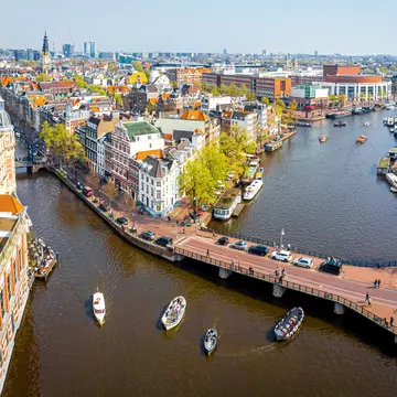 A river and a canal branching off around a built-up city