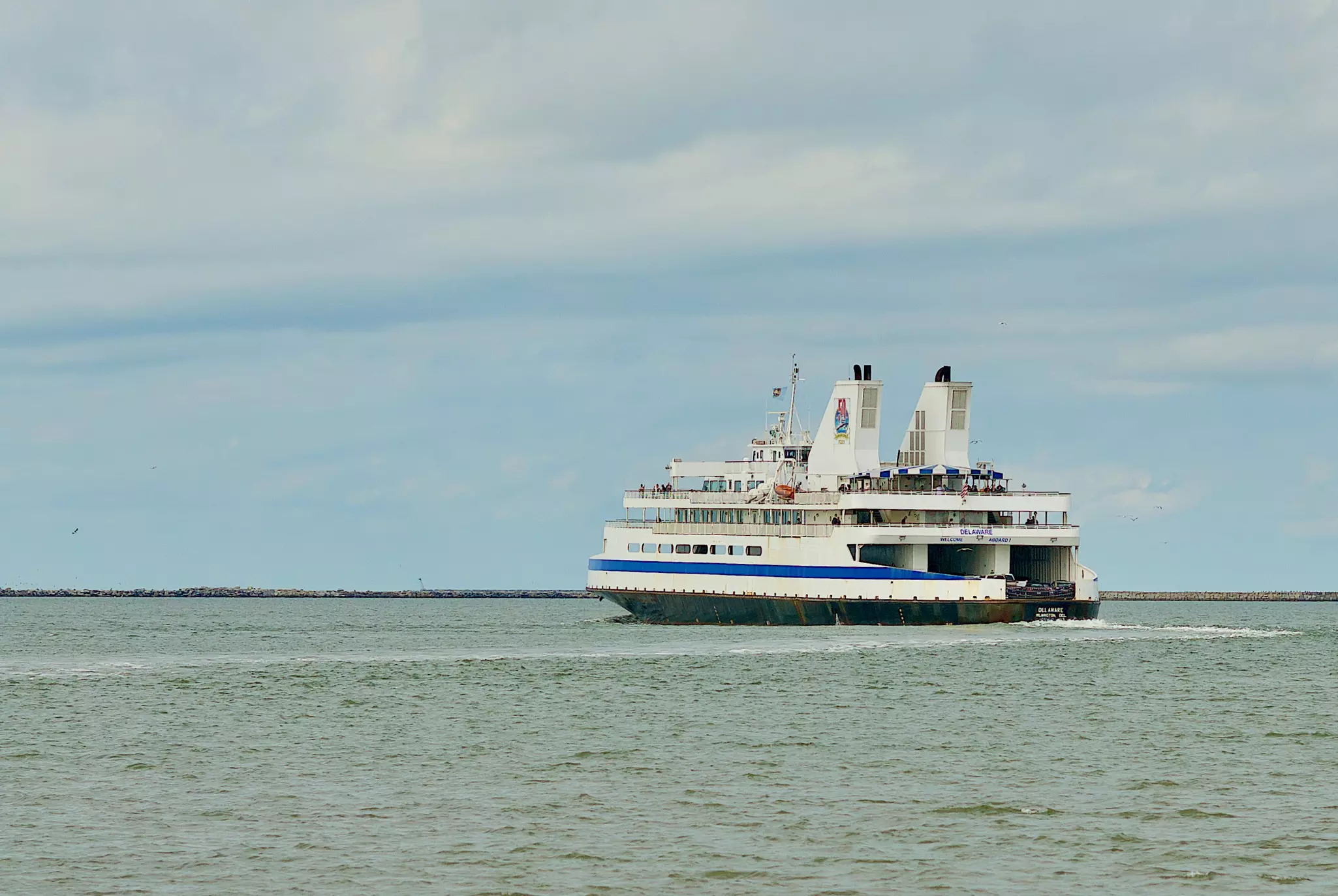 The Cape May-Lewes Ferry – a large passenger and vehicle ferry – gliding over calm water