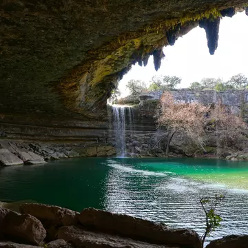 Beautiful waterfall in Hamilton Pool Preserve grotto in Central Texas with turquoise swimming hole; Shutterstock ID 1282209841;