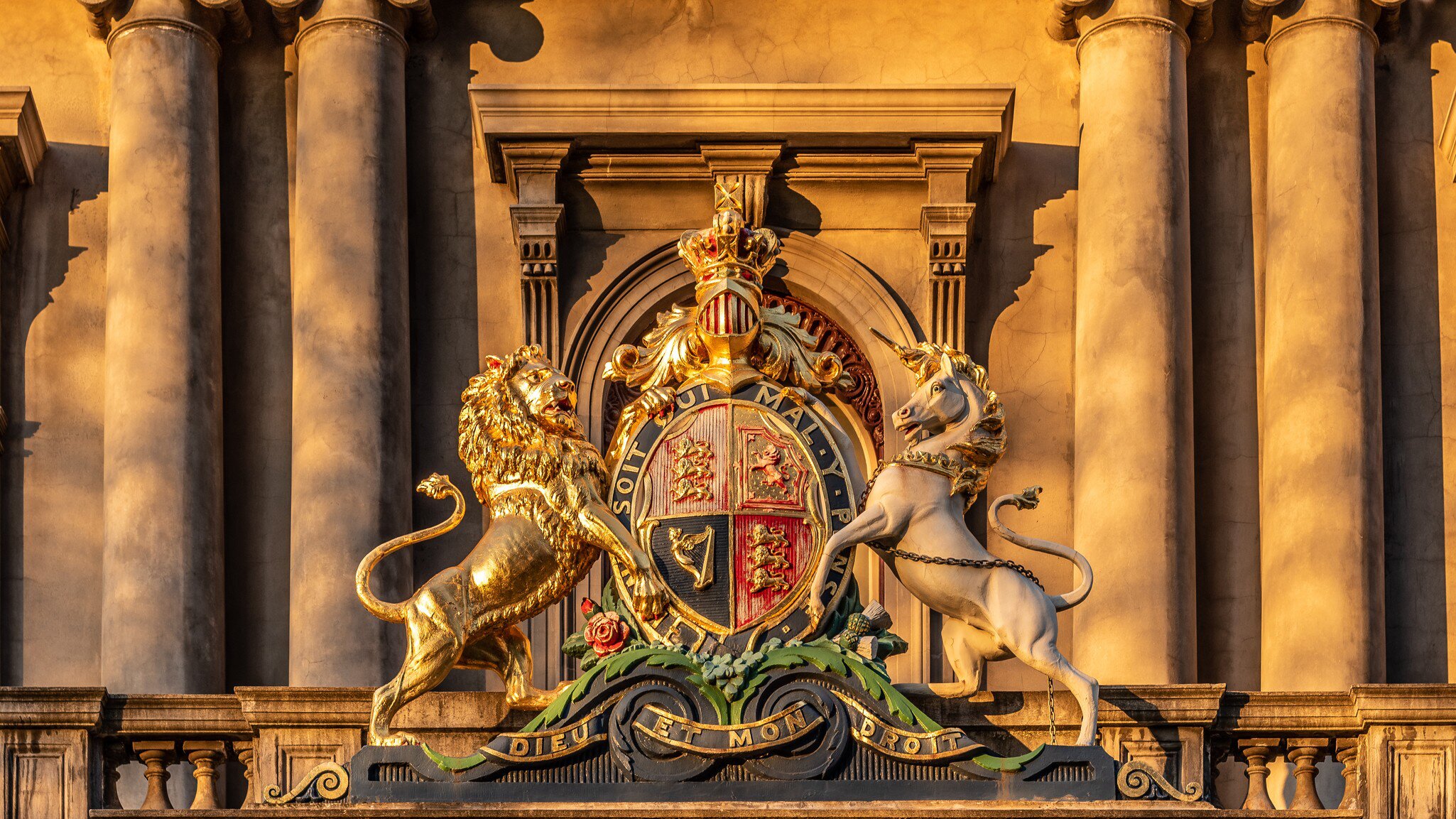 A Coat of Arms in the late afternoon golden hour sunlight on the old Royal Mint Building, now the Hellenic Museum in Melbourne, Australia.