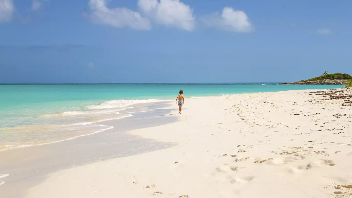 Child running in Tropic of Cancer Beach - Bahamas