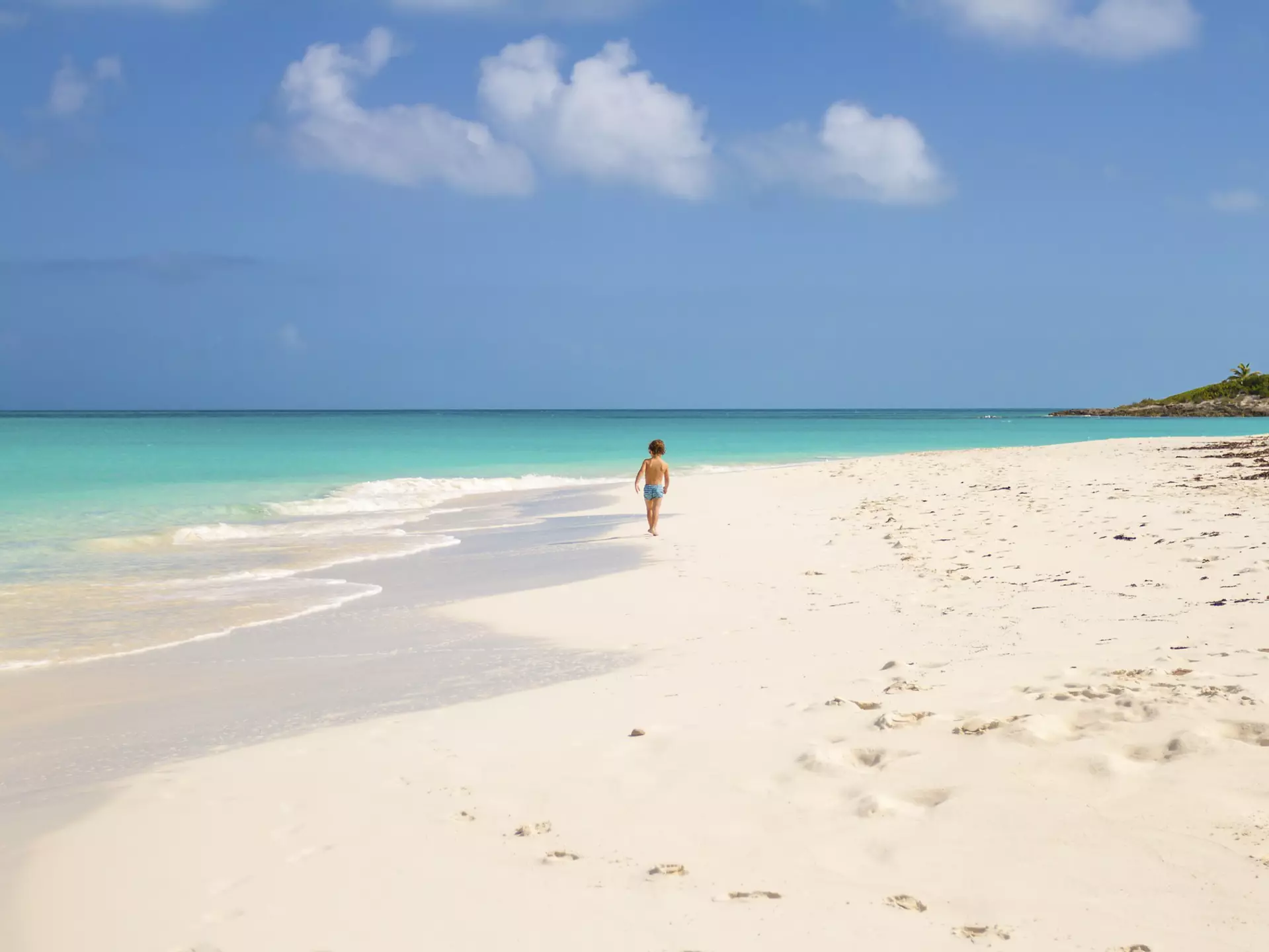 Child running in Tropic of Cancer Beach - Bahamas